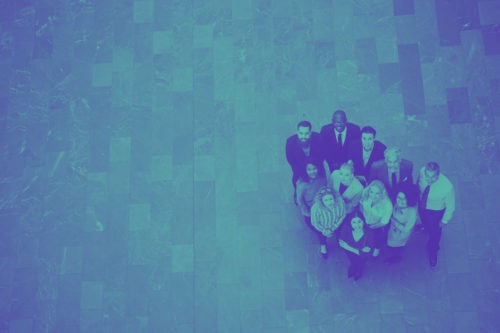 Diverse group of laughing businesspeople working in an office