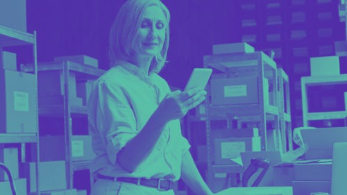 Woman working on frontline using mobile device